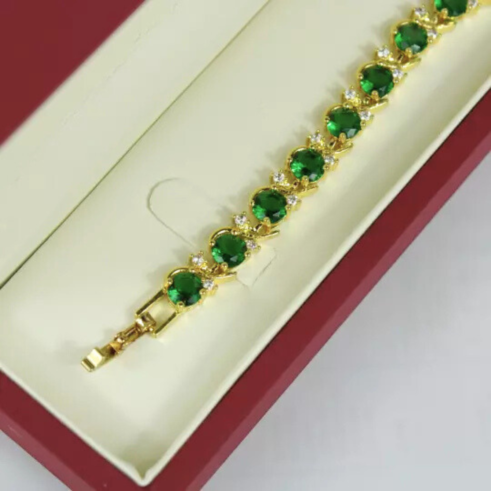 Yellow Gold Finish Green Emerald Twist Tennis Bracelet – Elegant Jewelry Gift