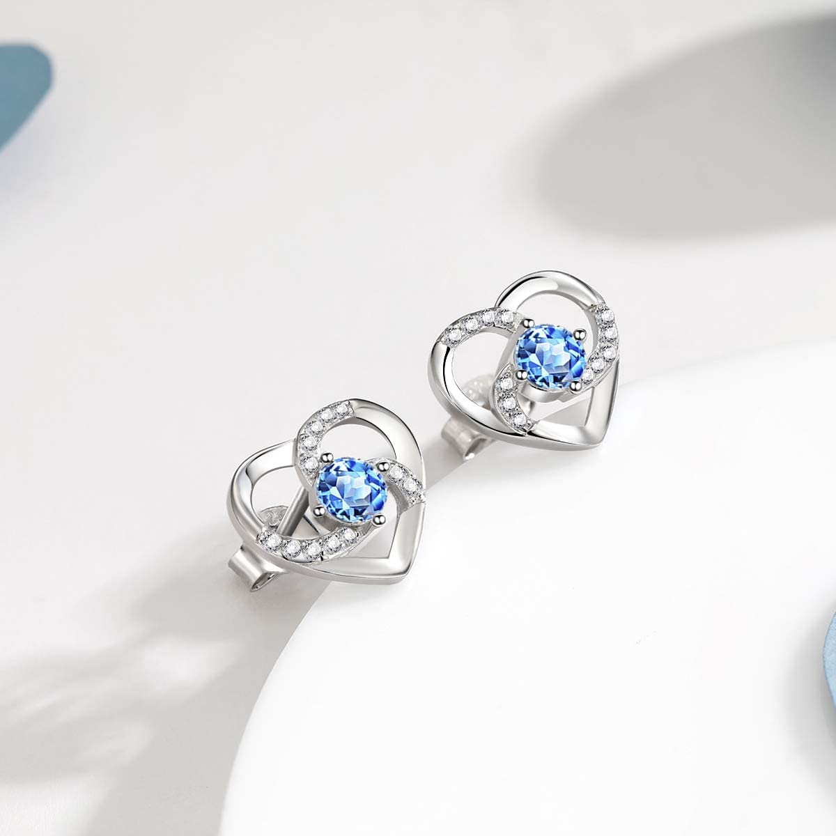 Amour – WHITE GOLD FINISH 925 Sterling Silver Round Cut Blue Topaz Created Diamond Heart Swirl Earrings