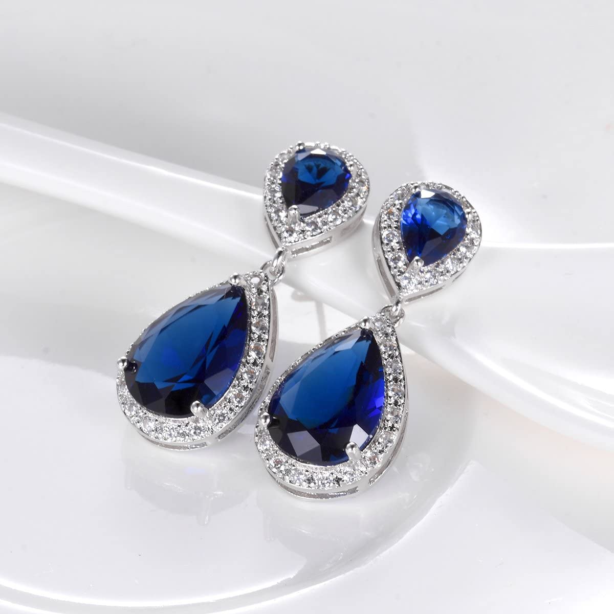 Elegance – White Gold Finish Cluster Royal Blue Created Diamond Teardrop Dangle Earrings