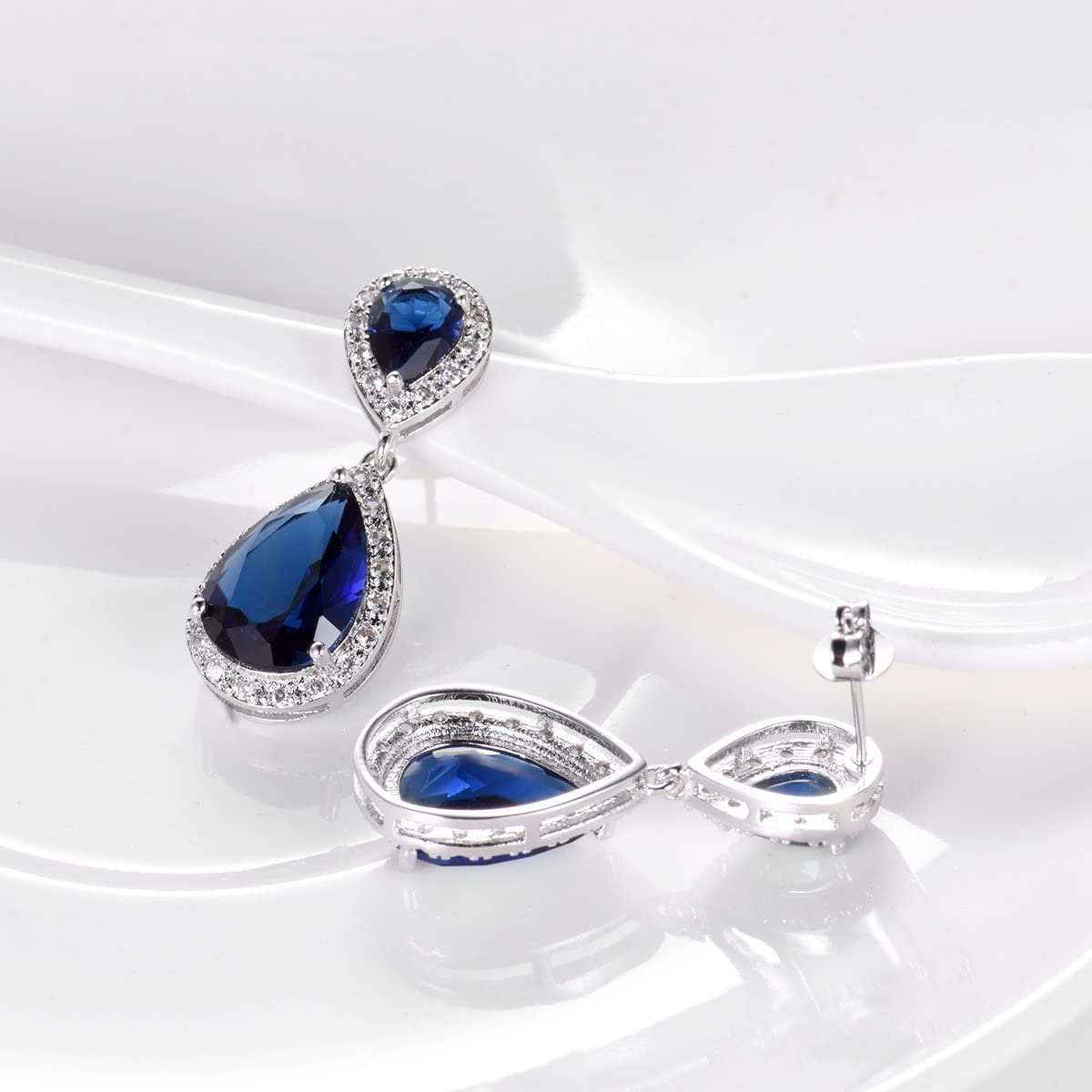 Elegance – White Gold Finish Cluster Royal Blue Created Diamond Teardrop Dangle Earrings