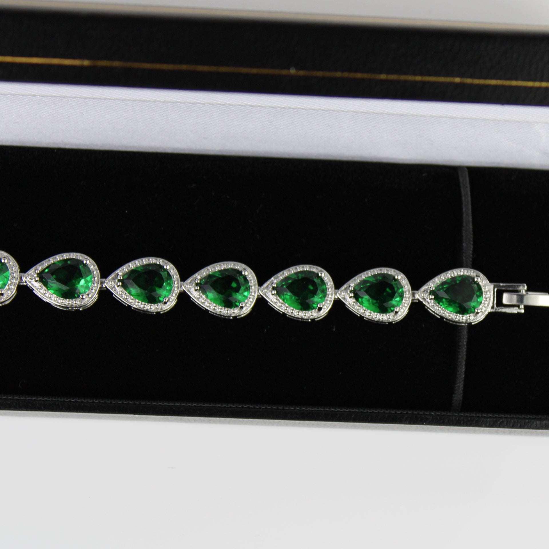 White gold finish Emerald and created diamonds pear cut bracelet