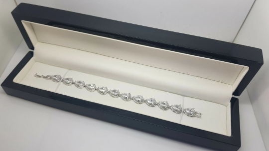 White gold finish created diamond pear cut tennis bracelet in luxury black box