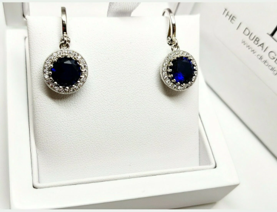 White gold finish blue sapphire and created diamond round cut droplet earrings