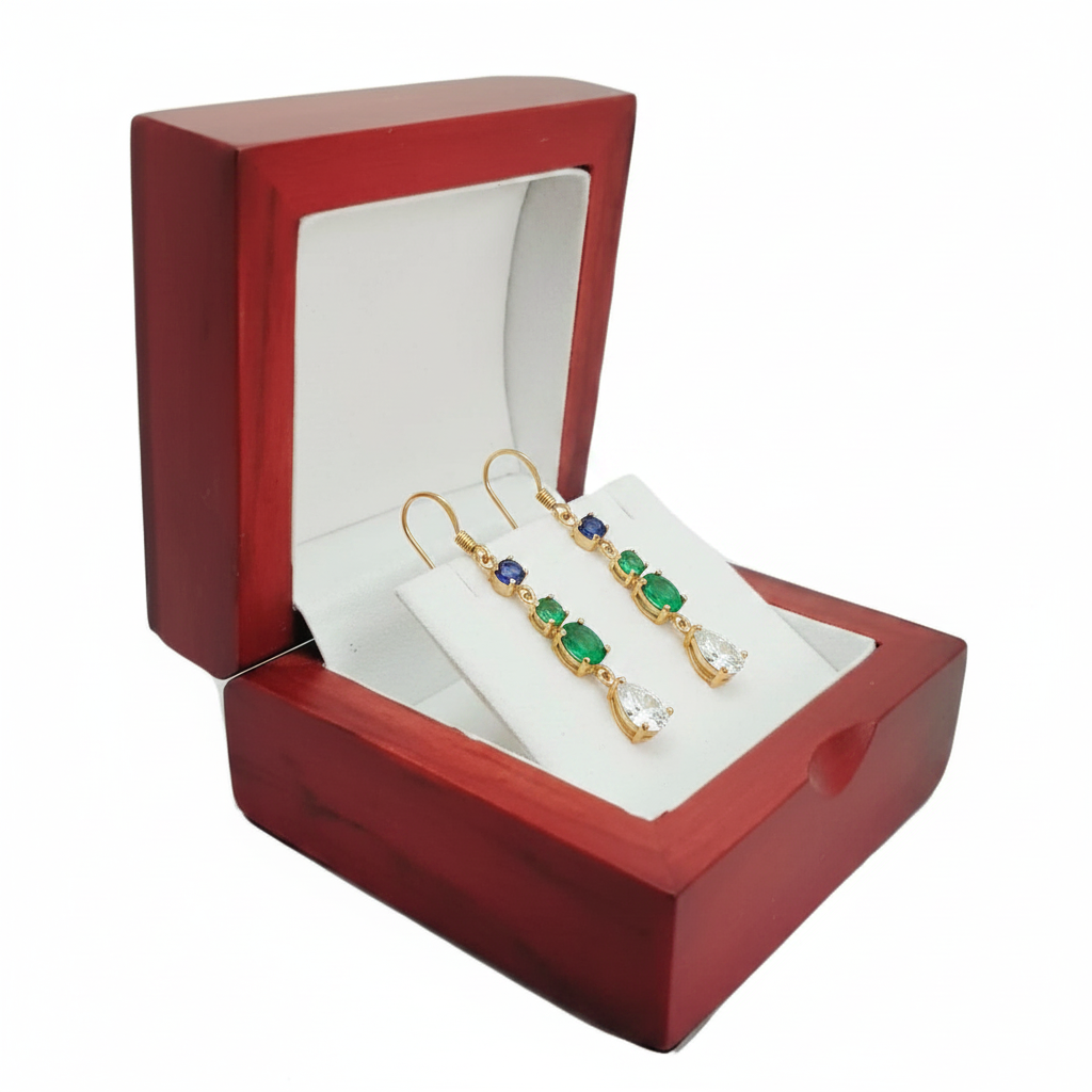 Red woodland matte jewellery box open with gold gemstone drop earrings on white cushioned interior