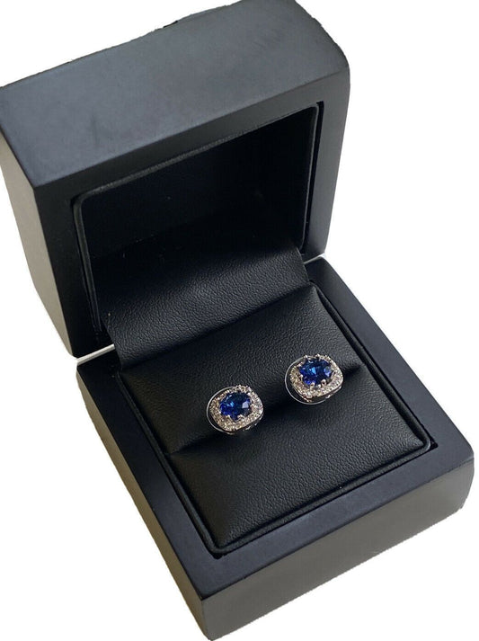 White Gold Finish Round Cut Sapphire And Created Diamond Stud Earrings